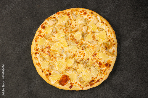 Pizza with chicken and pineapple