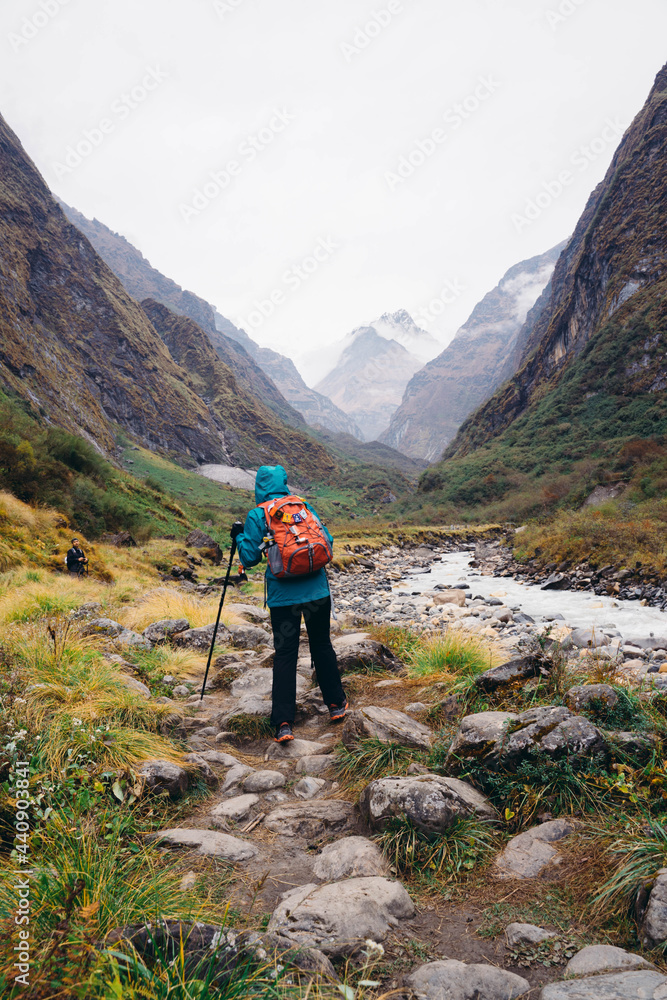 The woman trekking on the way to Annapurna base camp.