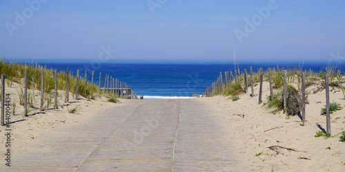 panoramic beach sea with sand dunes and sandy wooden floor fence access on atlantic ocean in gironde France southwest