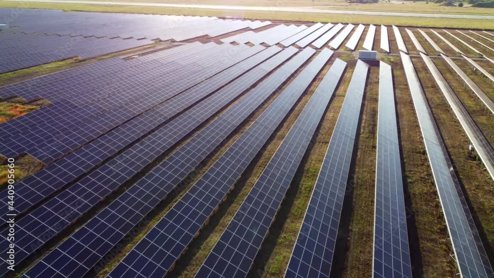Aerial drone view flight over solar power station panels. Aerial drone view flight over solar power station panels.