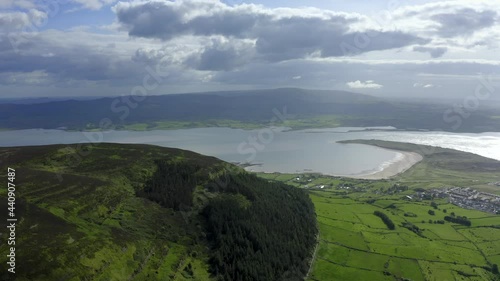 Knocknarea, Coolera peninsula, Sligo, Ireland, June 2021. Drone slowly pulls backwards revealing Queen Meave's Grave at the summit, with views of Carrowdough and Ballysadare Bay in the background photo