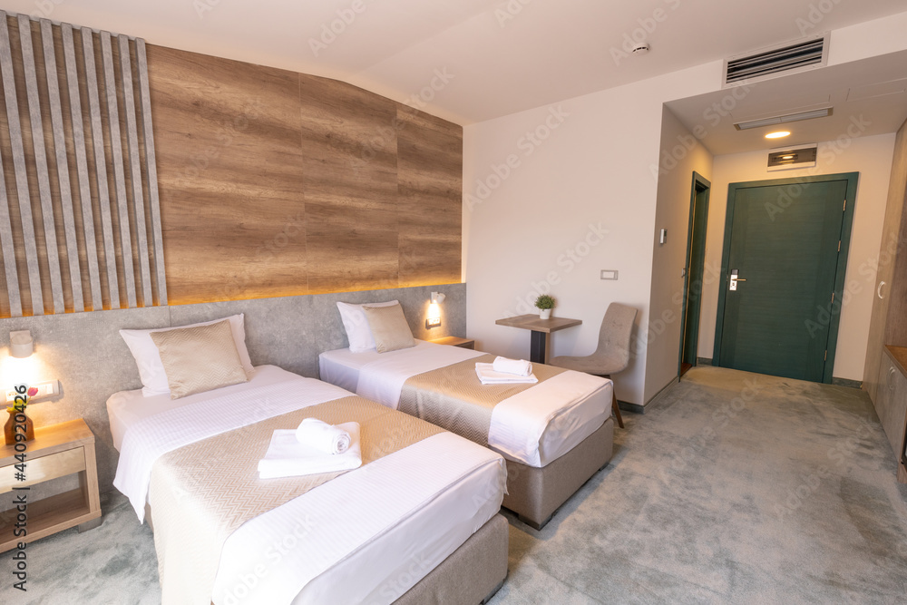 Fototapeta premium Interior of a double bed hotel bedroom in modern luxury hotel