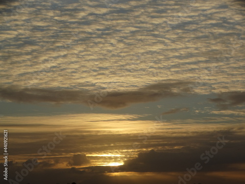 Sunscape. Panoramic background. Interplay of sun and clouds. Landscape with sun and clouds. Sunrise. Zon door de wolken. © Stobbe