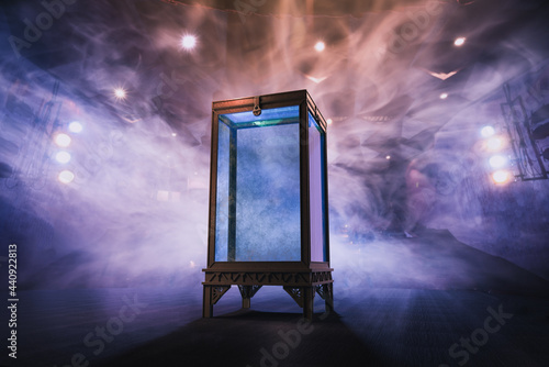 Принти на полотні locked water tank used for tricks by magicians and illusionists in a dark wooden background