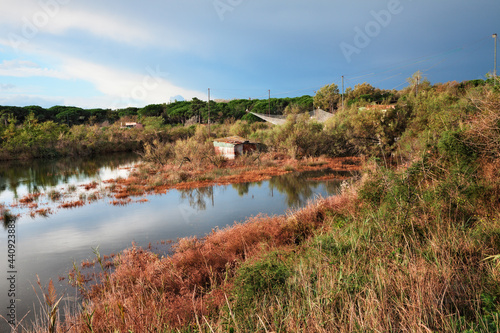 Ravenna, Emilia Romagna, Italy: landscape of the wetland with fishing huts in the nature reserve Po Delta Park