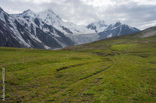 Trekking trail in Patundas trekking route with Passu glacier in background, Karakoram mountains range in Pakistan photo