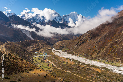 Pangboche village surrounded by Himalaya mountains range in Everest region, Nepal photo