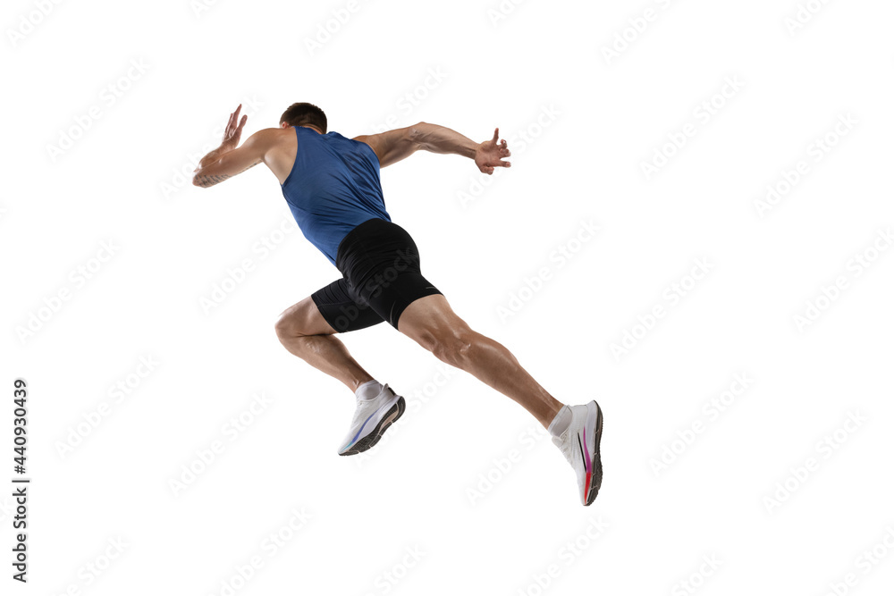 Caucasian professional male athlete, runner training isolated on white studio background. Muscular, sportive man. Concept of action, motion, youth, healthy lifestyle. Copyspace for ad.