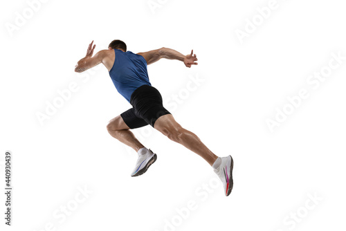 Caucasian professional male athlete, runner training isolated on white studio background. Muscular, sportive man. Concept of action, motion, youth, healthy lifestyle. Copyspace for ad. © master1305