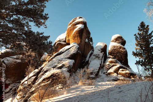 rocks covered with snow in winter, Stolby National Park, Krasnoyarsk photo