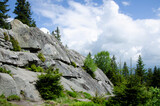 Beautiful green landscape. Big rocks in the forest. Sunny day in the Carpathian Mountains.