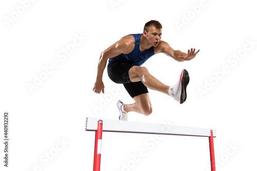 Athlete man athlete jumps over the barrier isolated on white background.