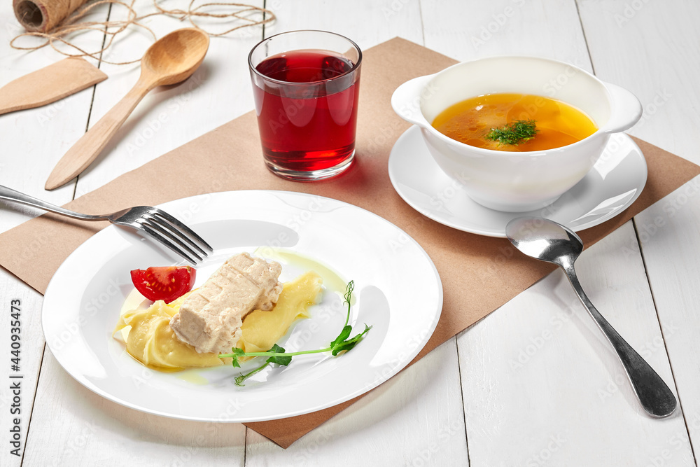 Kids set lunch of vegetable soup, mashed potatoes with chicken patty, berry compote Kids set lunch of vegetable soup, mashed potatoes with chicken patty, berry compote