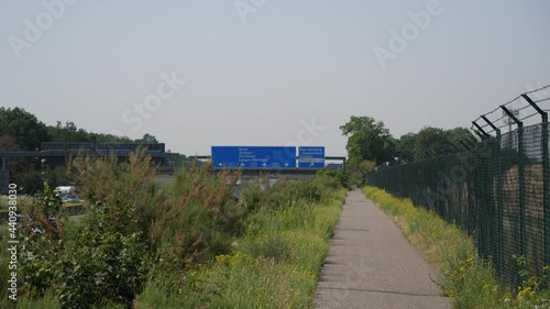 Establishment shot of traffic sing at the A5 Highway below the signage shows the direction to Cargocity Süd Airport in Frankfurt, Germany