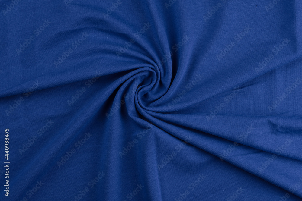 Background from blue monochrome cotton fabric. Close up texture of the fabric is useful as a background. Background from blue monochrome cotton fabric. Close up texture of the fabric is useful as a background.