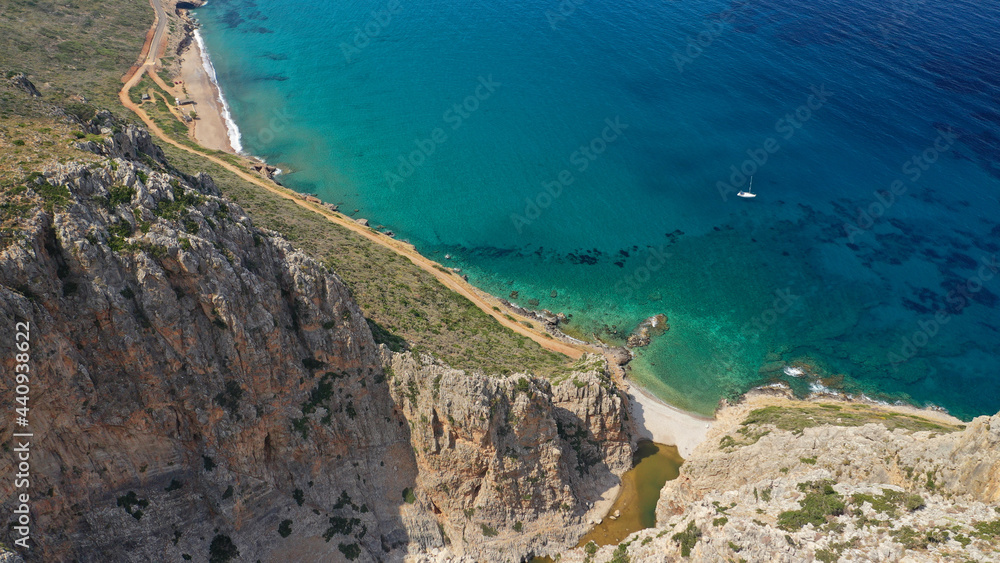 Aerial drone top down photo of scenic turquoise beach and small lake of Kaki Lagada in the end of Canyon starting from ancient city of Kythera island - Palaiochora, Ionian, Greece