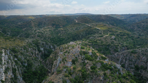 Aerial drone photo of ruins of Byzantine Medieval ancient city of Palaiochora - old Kythira island capital built in start of Canyon leading to Kaki Lagada beach  Ionian  Greece