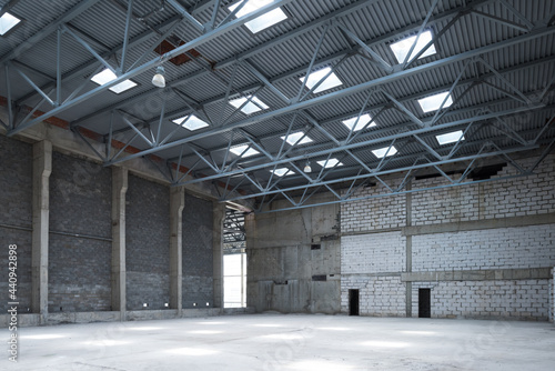 Large empty room. Manufacturing warehouse or construction site.