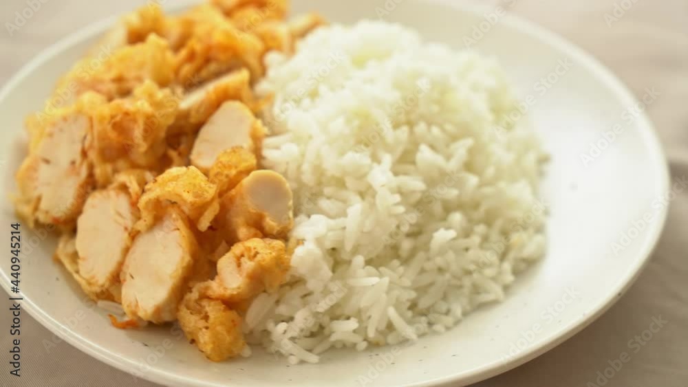 fried chicken topped on rice with spicy dipping sauce fried chicken topped on rice with spicy dipping sauce