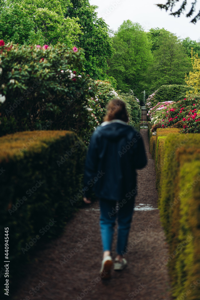 Women walking in a flower garden Women walking in a flower garden