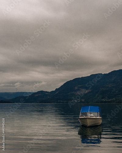 boats on the lake and mountains