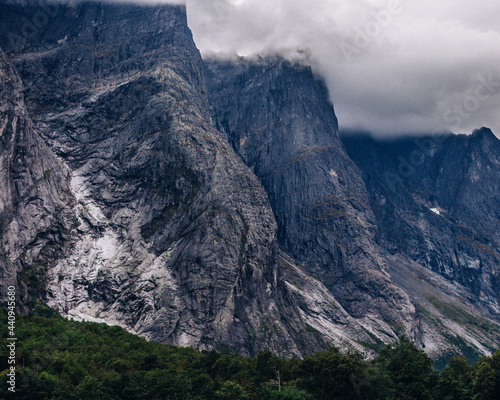 Detailed layered mountain cliffs and trees