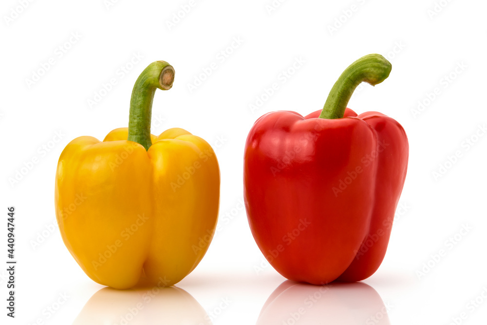Two red and yellow bell peppers isolated on white Two red and yellow bell peppers isolated on white