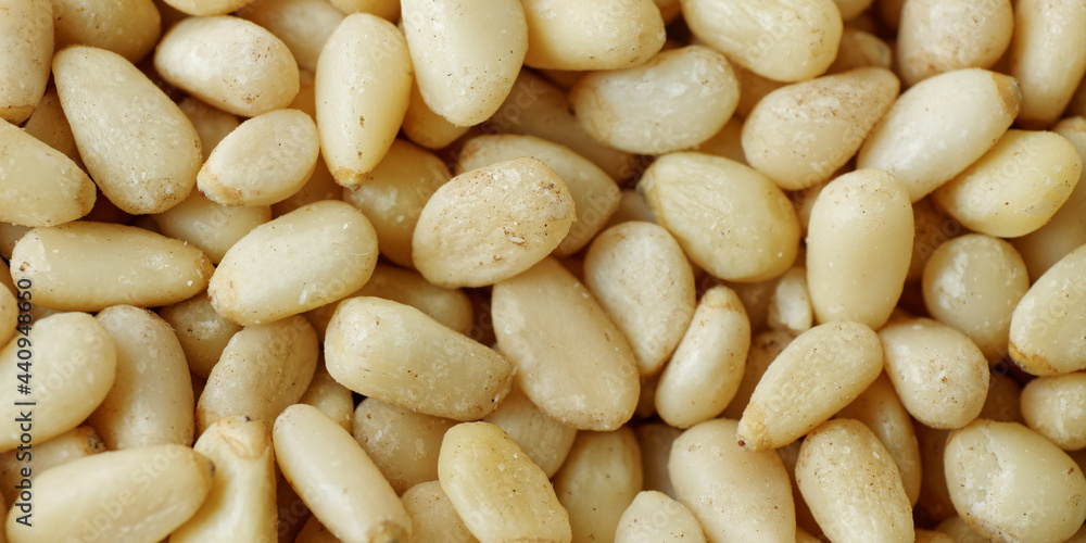 Pine nuts background. Abstract texture food close-up. Pine nuts background. Abstract texture food close-up.