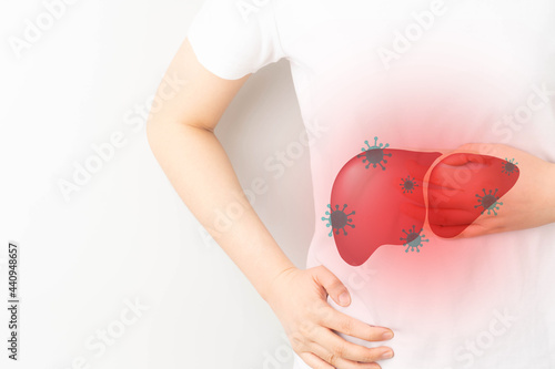 World hepatitis day concept. Woman suffering from abdominal pain with liver viral infection symbol. Awareness of prevention and treatment viral hepatitis that causes liver cancer.