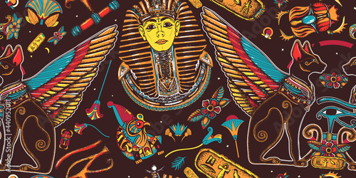 Ancient Egypt. Egyptian art. Tutankhamen. Seamless pattern. Golden king pharaoh, two winged black cats, sacred eye of god Horus