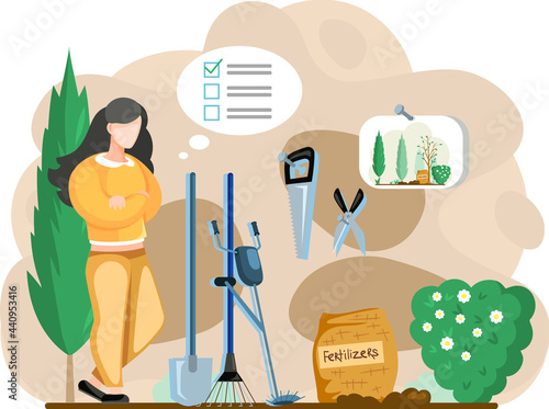 Gardener landscape designer woman standing in garden with trees or barn with tools with inventory list, fertilizers, scissors, saw, trimmer, rake, shovel. Graden worker preparing for outdoor season