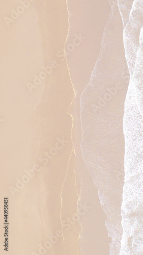 Foto Aerial view of beige coastline mobile wallpaper
