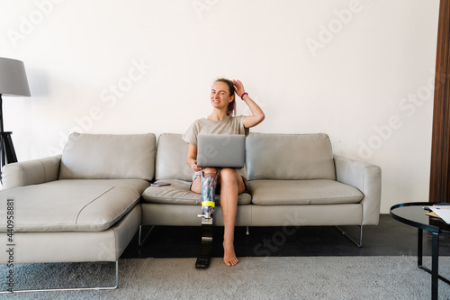 Smiling young white disabled woman with prostetic leg