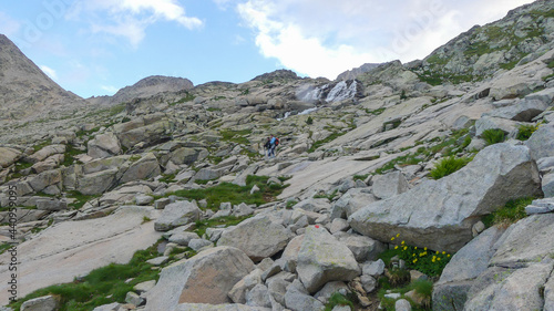Ascensión al pico de Aneto por corona pasando por los ibones y dirección al paso de corona y al glaciar. Montañas de los pirineos photo