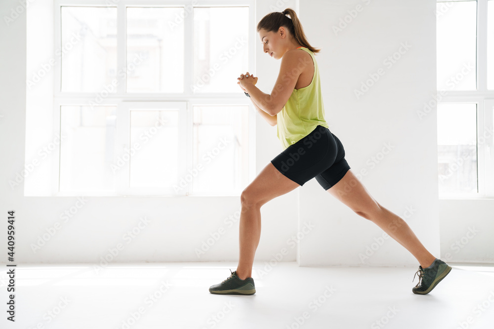 Fototapeta premium Stretching after great workout indoors
