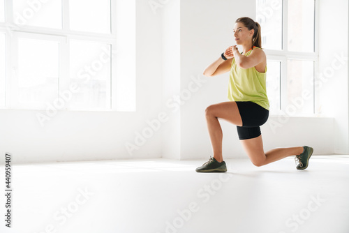 Stretching after great workout indoors photo