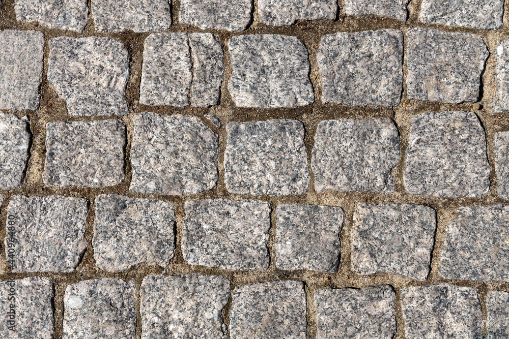 Grey stone background. Ancient stone pavement. Grey stone background. Ancient stone pavement.