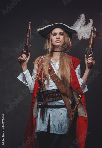 Caribbean woman buccaneer with dual flintlock pistols photo