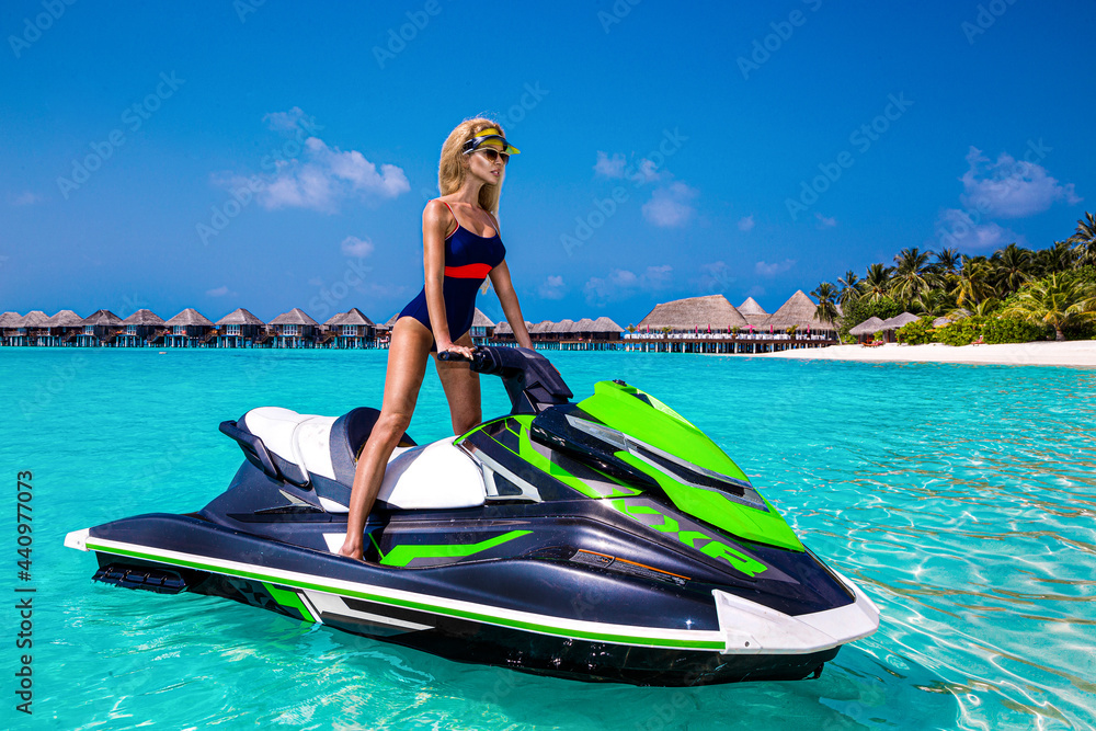 Sexy tanned woman bikini model at Maldives tropical sand beach. Glamour