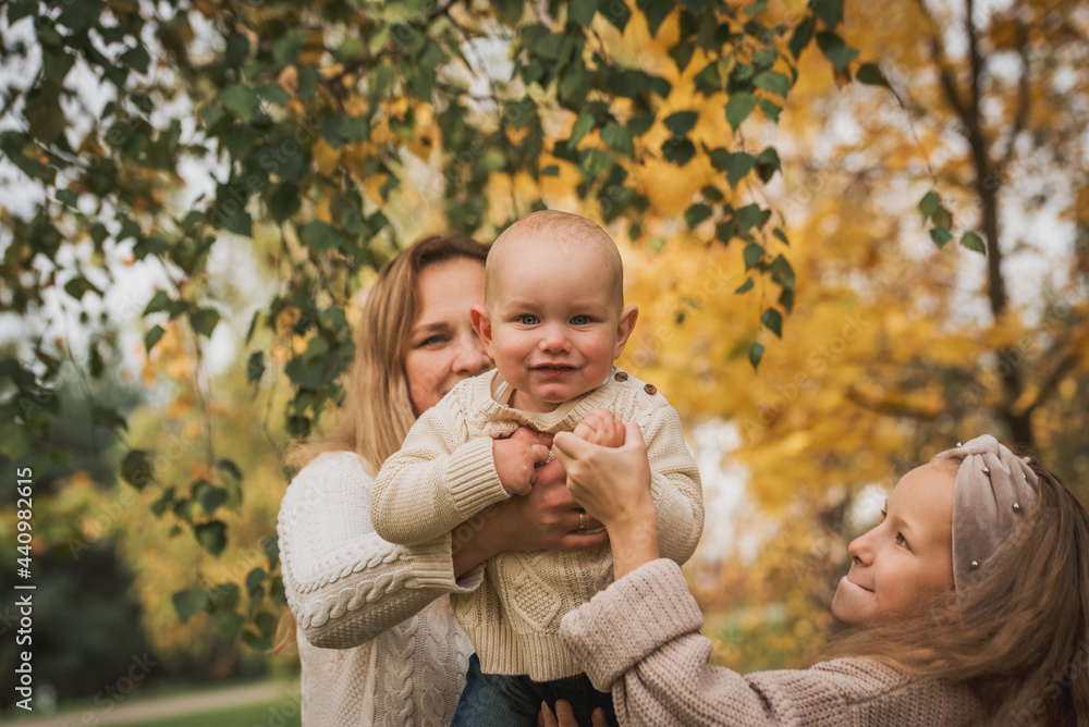 Happy family on autumn park. Mother and daughter walking in the Park Happy family on autumn park. Mother and daughter walking in the Park
