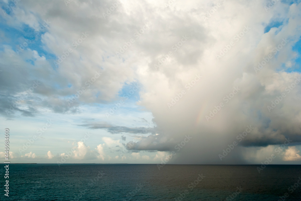 Caribbean Rain Cloud With A Rainbow