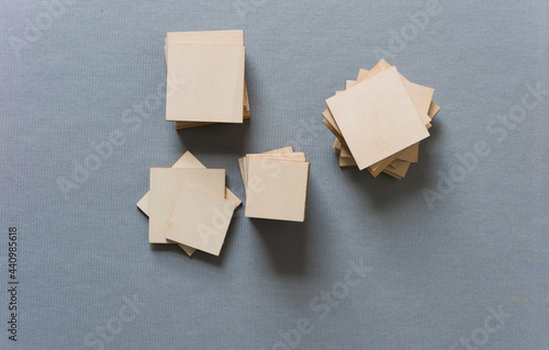 wooden shapes on medium grey background photo