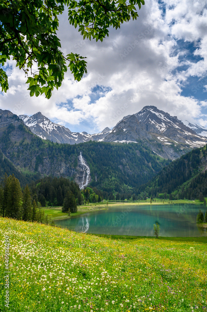 idyllic Lake Lauenensee with Wildhorn in spring, Bernese Alps, Switzerland idyllic Lake Lauenensee with Wildhorn in spring, Bernese Alps, Switzerland