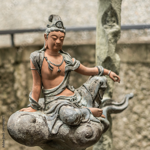 Photography stone statue of bodhisattva sit on a cloud