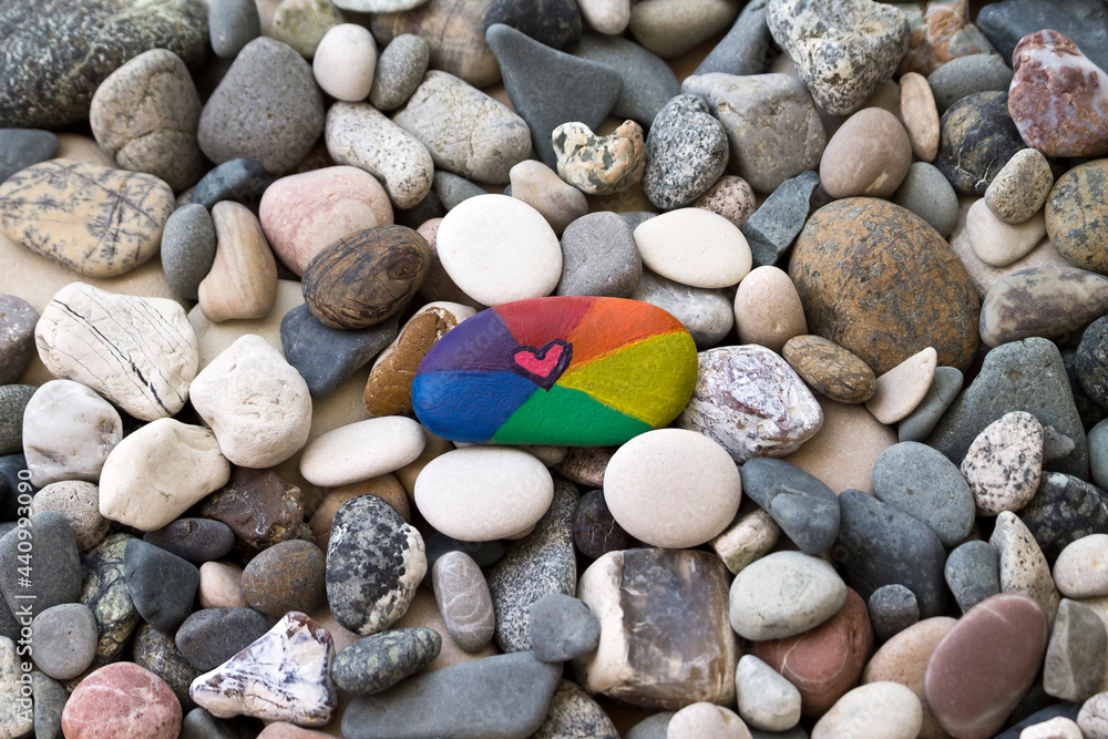 Rainbow colored stone on the beach Rainbow colored stone on the beach