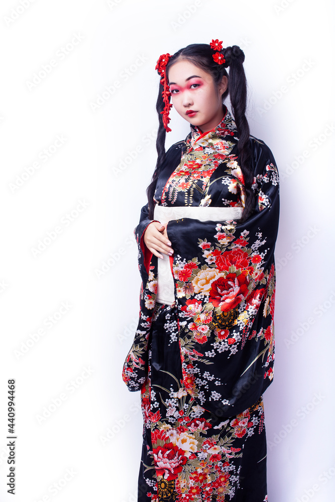 young pretty geisha in black kimono with sakura, asian ethno closeup on white background isolated young pretty geisha in black kimono with sakura, asian ethno closeup on white background isolated