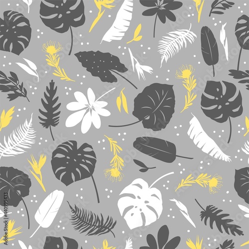 Vector Seamless pattern of tropical leaves  plants  flowers on grey and yellow. Beautiful print with exotic plants. Botanical design of fabrics  wallpapers  natural cosmetics  perfumes.