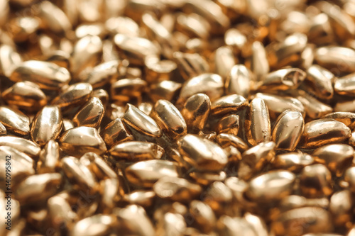 Golden wheat grains as background, closeup