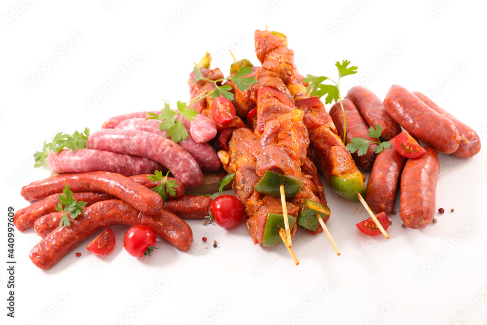 meats for barbecue- sausage, chorizo and skewer isolated on white background