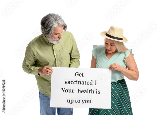 Senior couple holding poste...